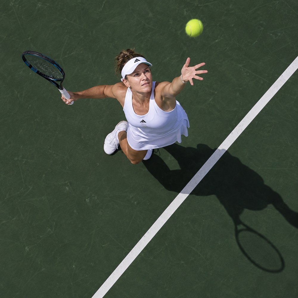 Tennis player on a green court